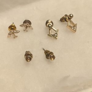 set of four gold earrings